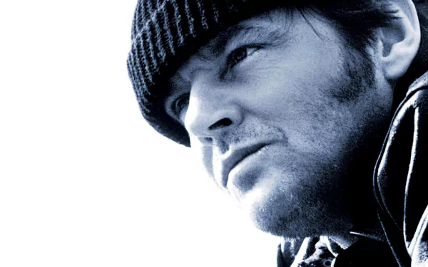 Close-up HD wallpaper of a rugged man in a knit cap, blue-tinted high-contrast cinematic portrait inspired by the film One Flew Over the Cuckoo's Nest.