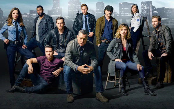 HD desktop wallpaper featuring the cast of Chicago P.D., centered on Hank Voight and other police characters from the TV show against a city skyline backdrop.