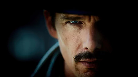 Close-up of Ethan Hawke's intense face from the movie Predestination, featured as an HD PC desktop wallpaper and background.