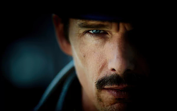 Close-up of Ethan Hawke's intense face from the movie Predestination, featured as an HD PC desktop wallpaper and background.