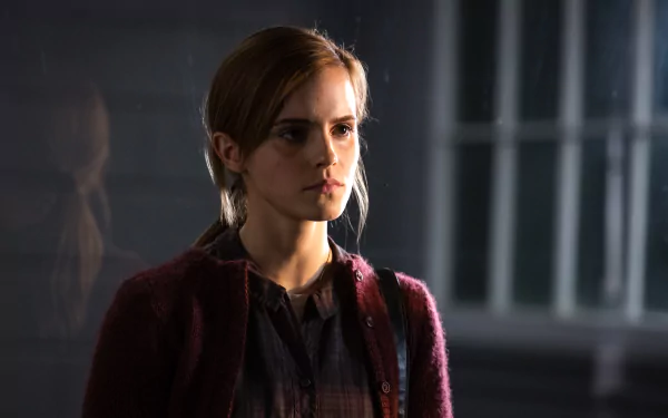 Emma Watson in a dark, intense scene from the movie Regression, featured in a 4K Ultra HD PC desktop wallpaper and background.