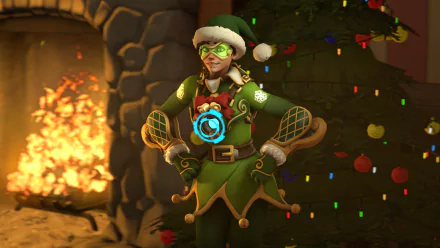 HD PC desktop wallpaper featuring Tracer from Overwatch in a festive holiday outfit, standing confidently by a cozy fireplace with Christmas decorations.