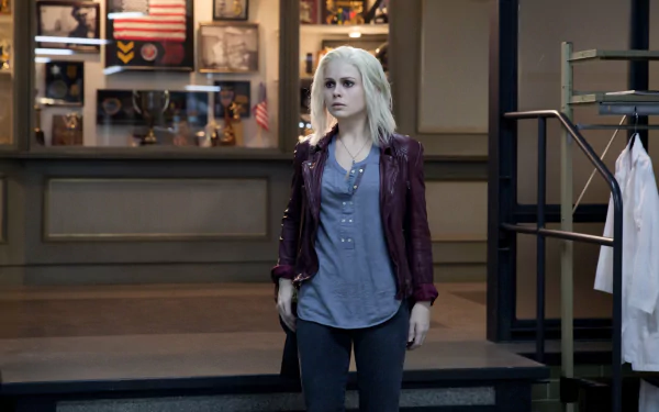 Liv Moore from the TV show iZombie stands in a lab-like lobby, pale-haired in a maroon jacket — 2K Quad HD PC desktop wallpaper/background.