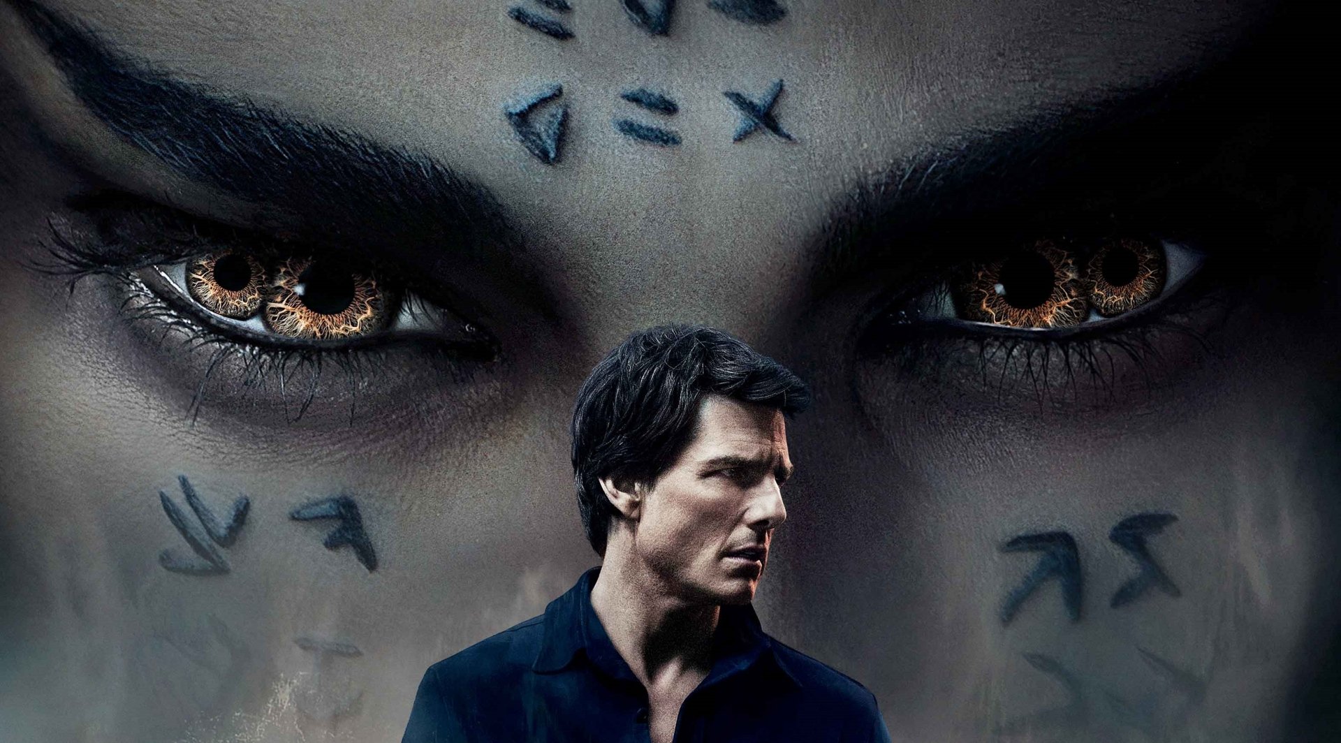 HD desktop wallpaper of the movie The Mummy (2017) featuring Tom Cruise, showcasing intense eyes with ancient symbols in the background.