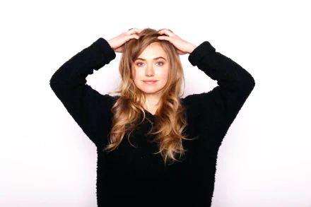 HD desktop wallpaper featuring English actress Imogen Poots with blue eyes and brunette hair, posing with hands on her head against a plain white background.