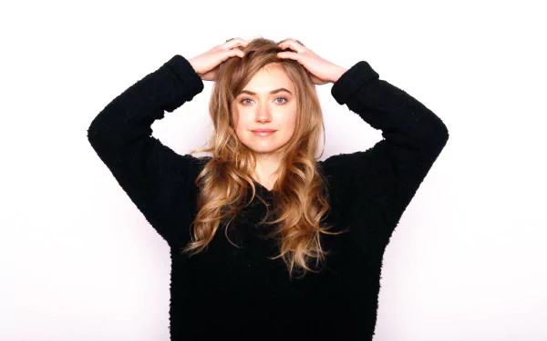 HD desktop wallpaper featuring English actress Imogen Poots with blue eyes and brunette hair, posing with hands on her head against a plain white background.