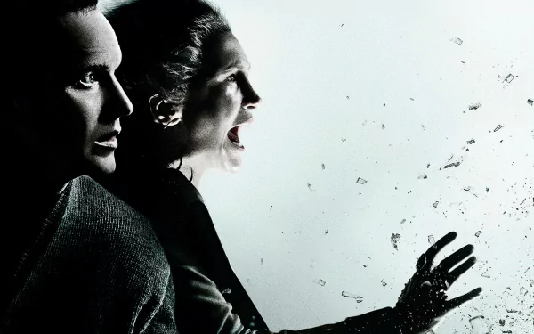 HD desktop wallpaper and background image from the movie The Conjuring 2, depicting two characters in a tense and dramatic moment, with one appearing to scream amidst shattered glass.
