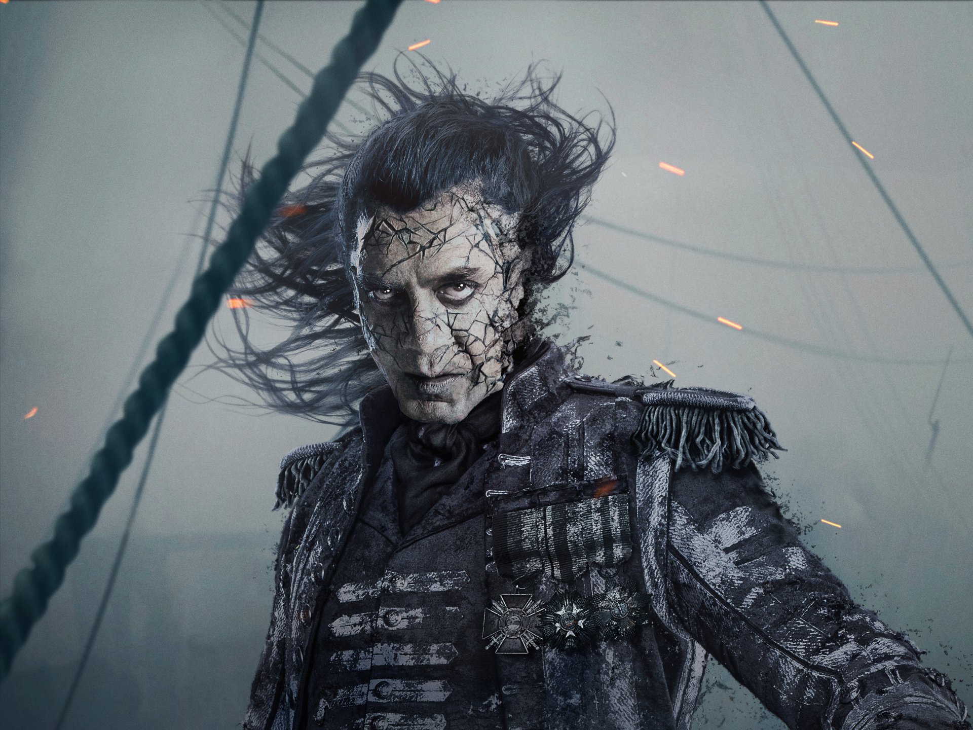 HD desktop wallpaper featuring Javier Bardem as Captain Salazar from the movie Pirates of the Caribbean: Dead Men Tell No Tales, with a dark, eerie background and sparks flying around.