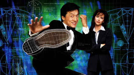 HD desktop wallpaper featuring Jennifer Love Hewitt and Jackie Chan from the movie The Tuxedo, with a dynamic background of blueprint designs and glowing effects.