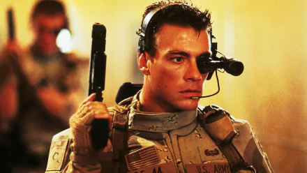 Close-up of a tactical soldier with headset and weapon in a scene from the movie Universal Soldier — HD PC desktop wallpaper and background.