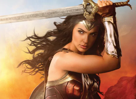 HD wallpaper featuring Gal Gadot as Wonder Woman from the movie, showcasing her in a dynamic pose with her sword against a vibrant background.
