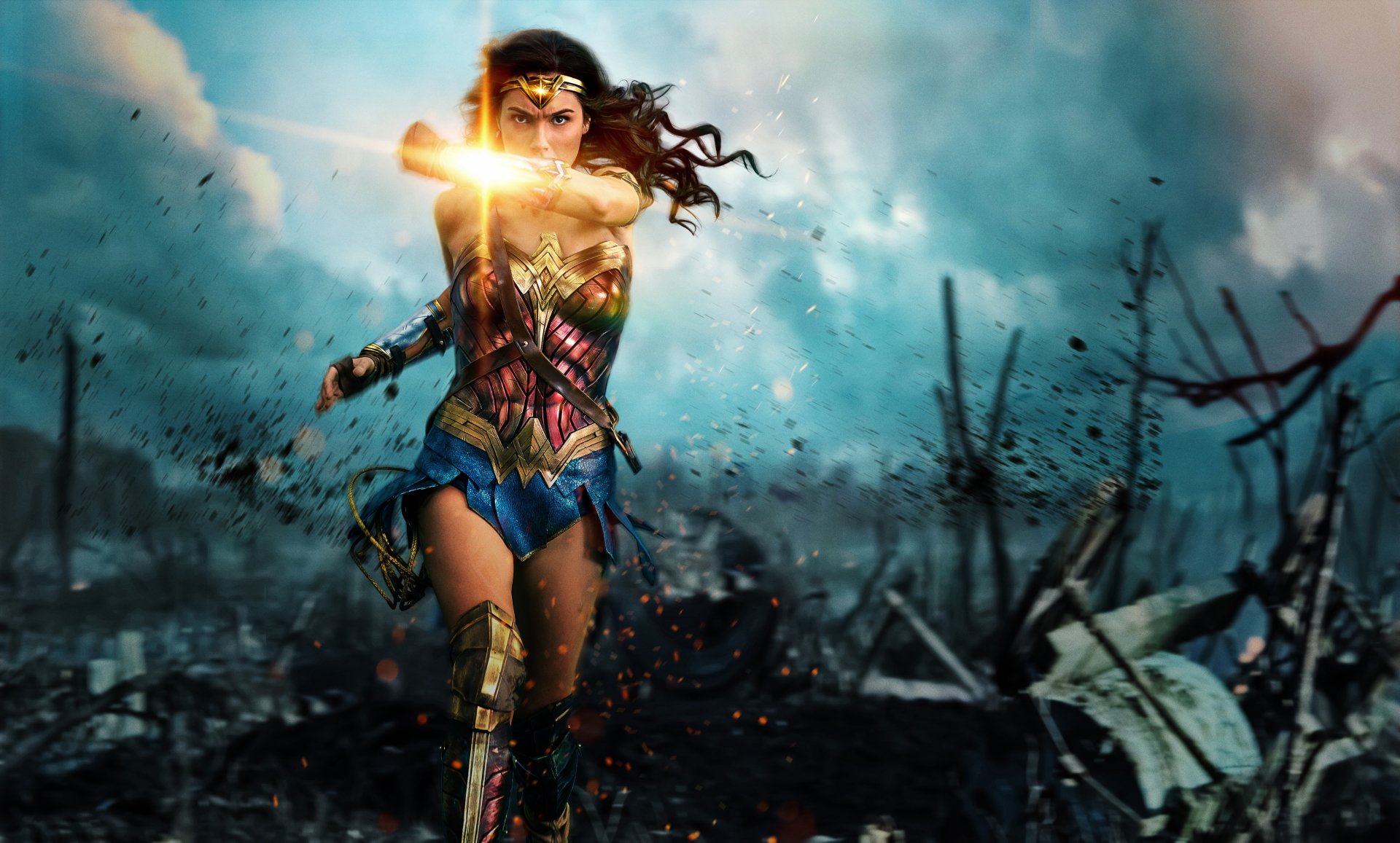 An HD desktop wallpaper featuring Gal Gadot as Wonder Woman, the superhero Diana of Themyscira from DC Comics, depicted in an intense action scene with a dramatic and stormy background.