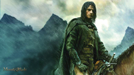 Video game Mount & Blade HD PC desktop wallpaper: cloaked warrior in rain-soaked mountains gripping reins and sword amid a moody green-gray atmosphere.