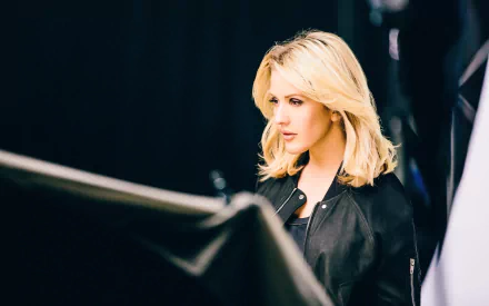HD desktop wallpaper featuring a blonde singer in a black jacket, tagged with music and Ellie Goulding. Black background for a dramatic, stylish look.