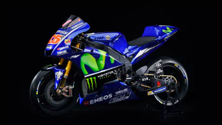 8K Ultra HD PC desktop wallpaper of a blue Yamaha YZR‑M1 racing vehicle (Yamaha YZR) with Monster Energy livery on a black background