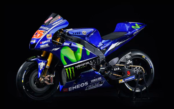 8K Ultra HD PC desktop wallpaper of a blue Yamaha YZR‑M1 racing vehicle (Yamaha YZR) with Monster Energy livery on a black background