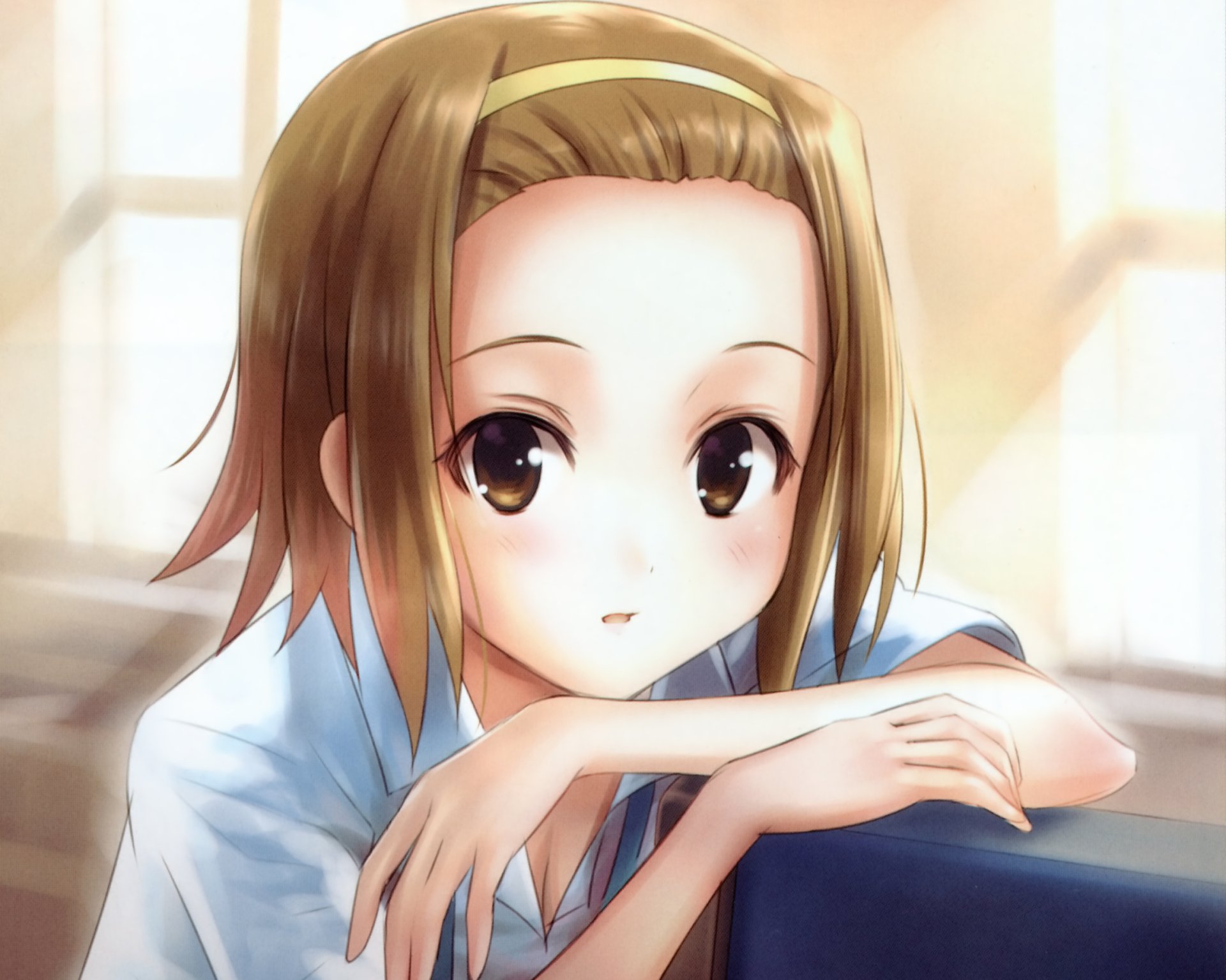HD PC desktop wallpaper of Ritsu Tainaka from K-ON!, anime close-up of her leaning on folded arms in a warm, sunlit classroom.