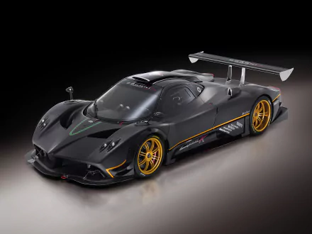 HD desktop wallpaper featuring the sleek and powerful Pagani Zonda R supercar in black, showcasing its impressive aerodynamic design and golden wheels against a dark background.