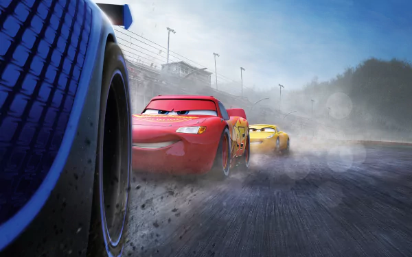 HD desktop wallpaper featuring Jackson Storm, Cruz Ramirez, and Lightning McQueen from the movie Cars 3, showcasing a dynamic race scene with detailed graphics and intense motion.
