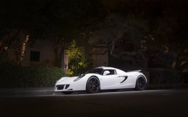 White Hennessey Venom GT supercar parked on a quiet street at night, low-angle profile shot — 4K Ultra HD PC desktop wallpaper/background.