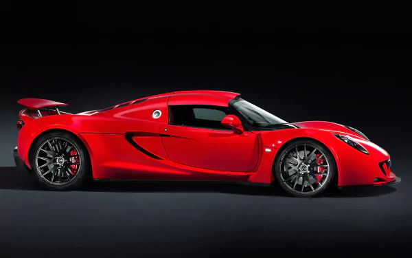 Side profile of a red Hennessey Venom GT supercar vehicle on a dark background — HD PC desktop wallpaper