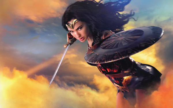 HD desktop wallpaper featuring Gal Gadot as Wonder Woman, wielding a sword and shield with a vibrant sky background.