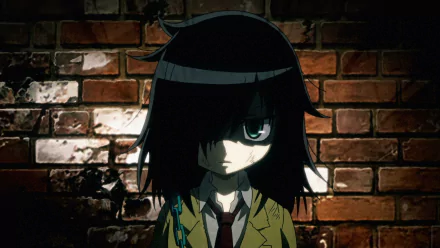 Tomoko Kuroki from the anime Watamote stands against a textured brick wall, her expression conveying a mix of intensity and introspection in this HD desktop wallpaper.