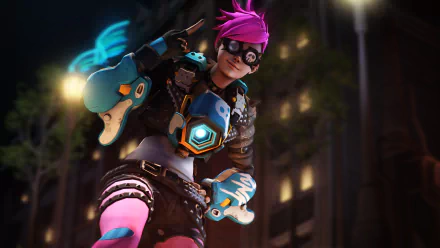 Tracer from Overwatch posing in a neon city at night, wearing blue-and-pink chronal gear and holding pulse pistols — 5K Ultra HD PC desktop wallpaper, video game background.