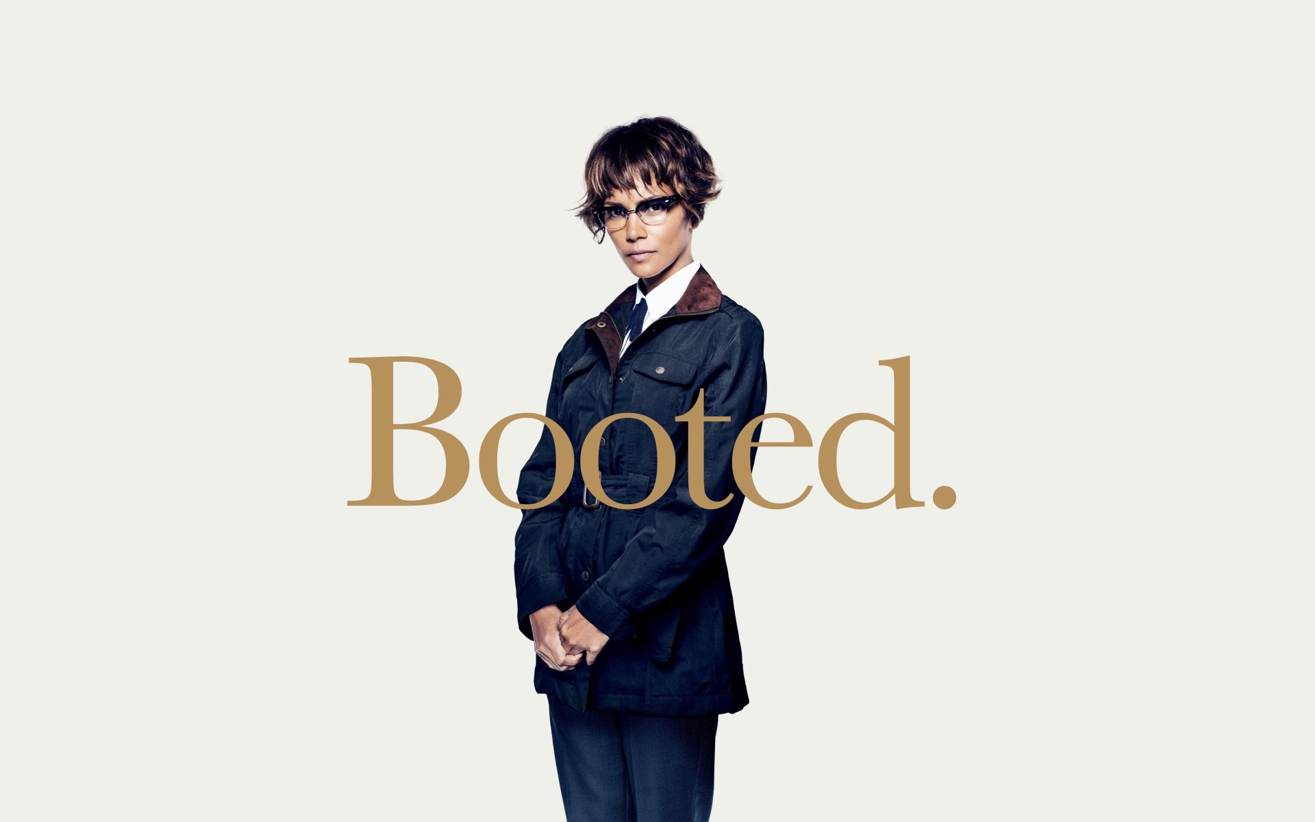 Unidentified woman in a dark suit and glasses against a white background with gold Booted. text — Kingsman: The Golden Circle 5K Ultra HD PC desktop wallpaper