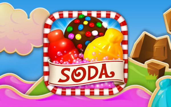 HD desktop wallpaper of Candy Crush Saga featuring colorful candies and a 'SODA' logo, set against a whimsical game landscape background.