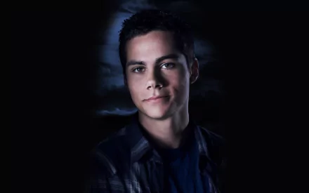 HD desktop wallpaper featuring a portrait of Dylan O'Brien against a dark, moody backdrop.