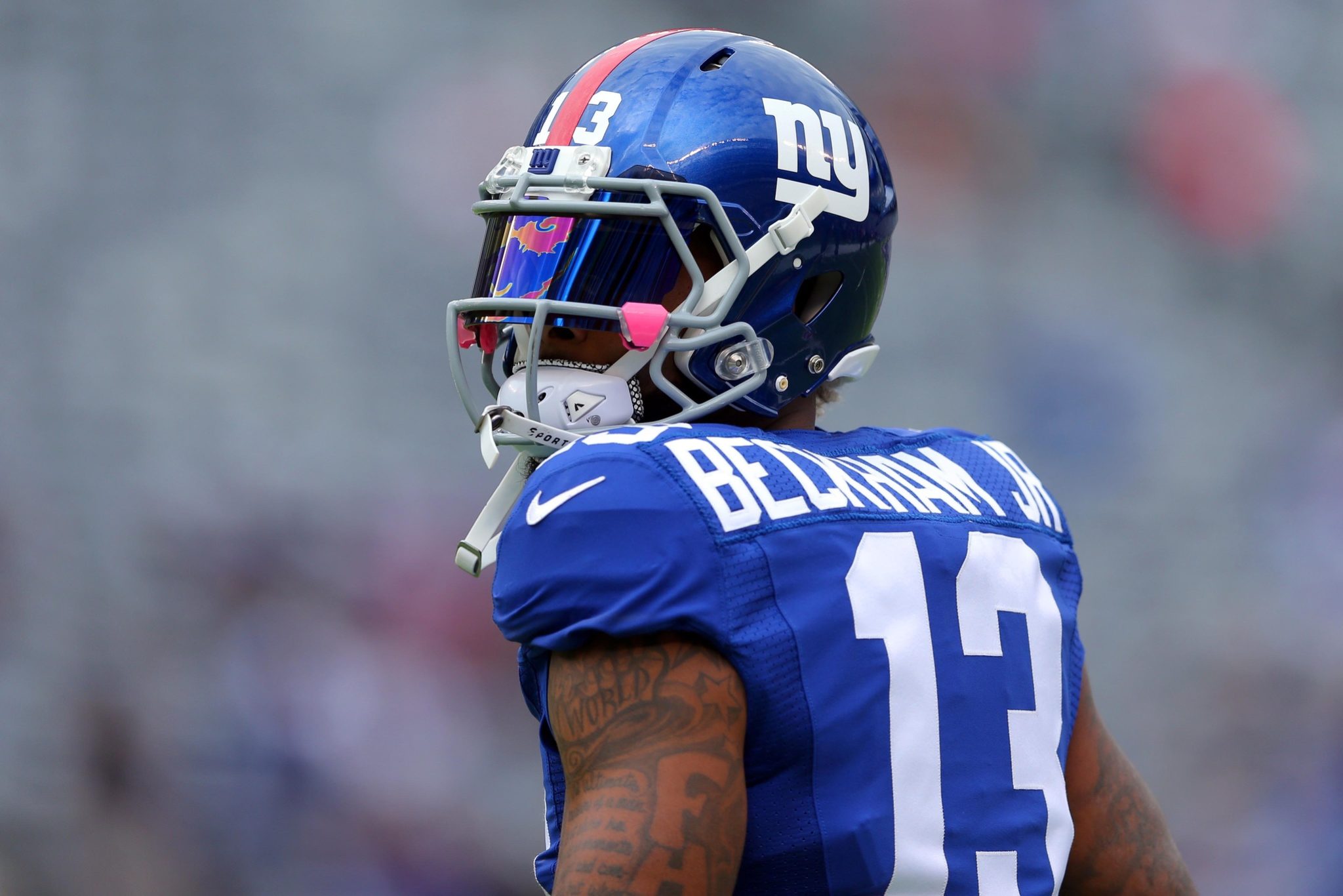 A New York Giants player in a blue #13 jersey on the field, serving as a HD desktop wallpaper and background.