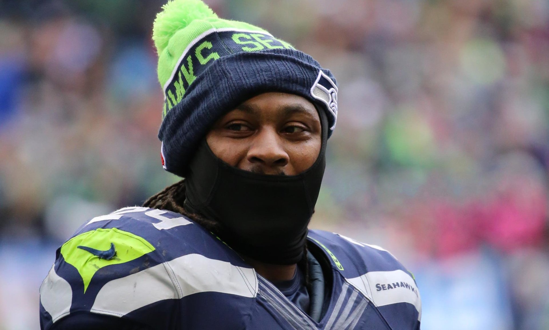 HD desktop wallpaper featuring Seattle Seahawks player Marshawn Lynch wearing team gear.