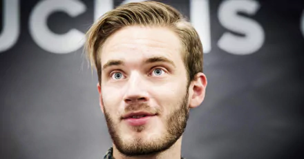 HD desktop wallpaper featuring a close-up of a man with facial hair and a surprised expression.