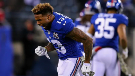 HD wallpaper featuring Odell Beckham Jr. of the New York Giants in action on the football field.