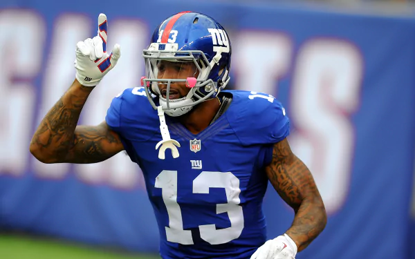 HD desktop wallpaper featuring New York Giants player Odell Beckham Jr. in his blue number 13 jersey on the field.