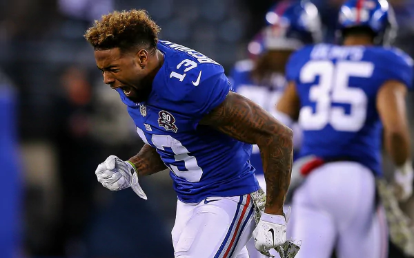 HD wallpaper featuring Odell Beckham Jr. of the New York Giants in action on the football field.
