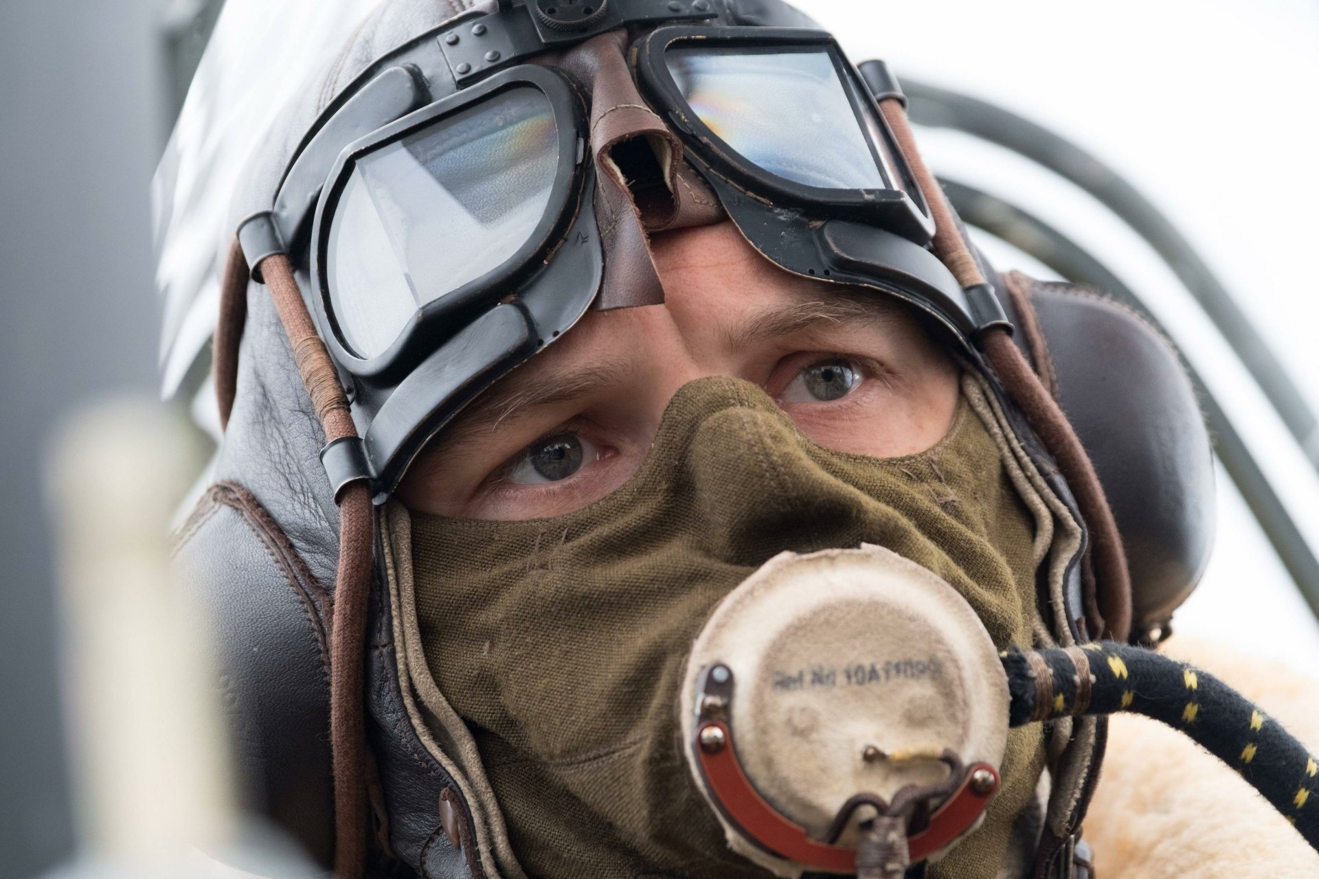 HD desktop wallpaper of Tom Hardy from the movie Dunkirk, featuring a close-up of him in pilot gear, with goggles and a mask.