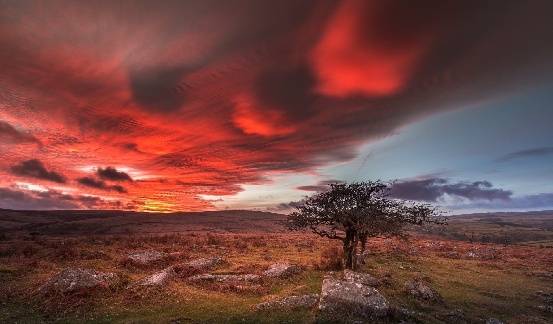 HD PC desktop wallpaper/background: fiery clouds stretch across the sky over a rocky nature landscape, a solitary tree silhouetted against the dramatic cloudscape.