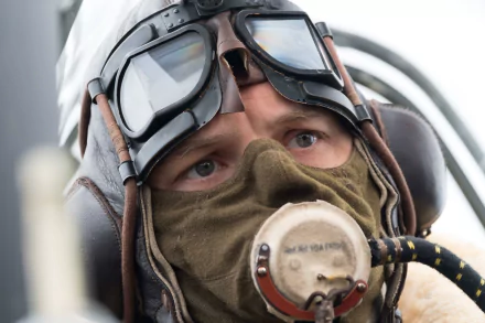 HD desktop wallpaper of Tom Hardy from the movie Dunkirk, featuring a close-up of him in pilot gear, with goggles and a mask.