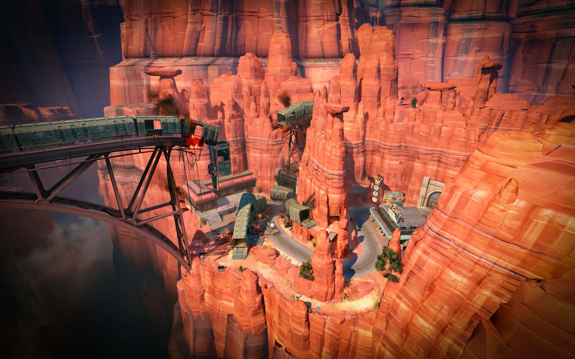 Aerial view of an Overwatch canyon map with red-rock cliffs, bridges and a winding road — 5K Ultra HD PC desktop wallpaper and background (video game).