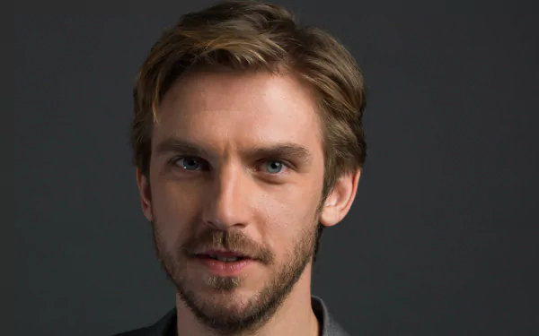 HD desktop wallpaper featuring a portrait of a man with a dark backdrop, providing an engaging background for screens.