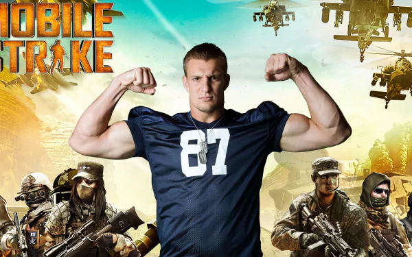 HD desktop wallpaper featuring Mobile Strike with a muscular figure in jersey number 87 flexing, flanked by soldiers and helicopters in the background.
