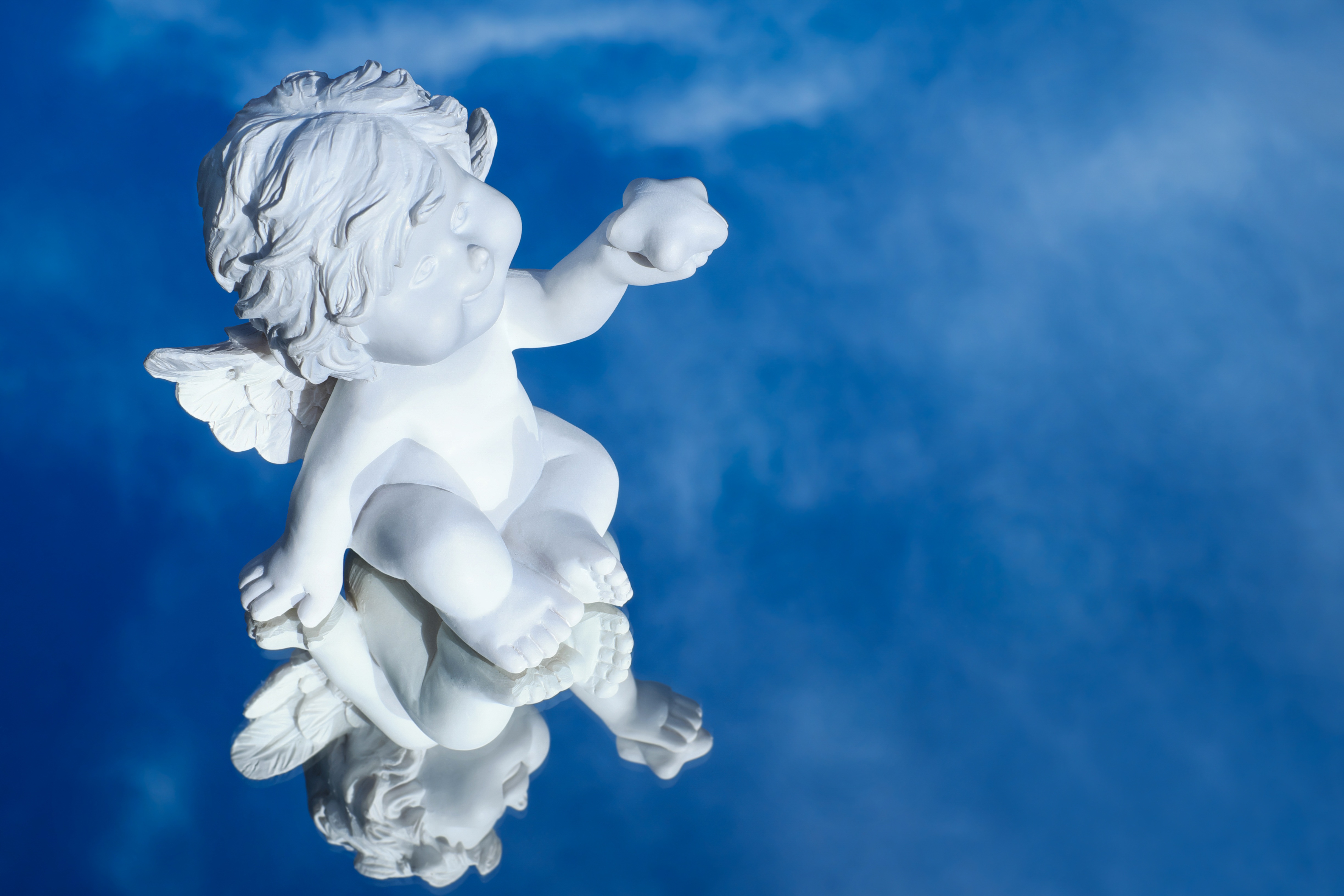 Baby Cherub on a Blue Background by Couleur