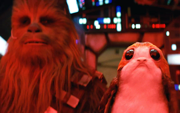 HD desktop wallpaper from Star Wars: The Last Jedi featuring Chewbacca and a Porg inside the Millennium Falcon.