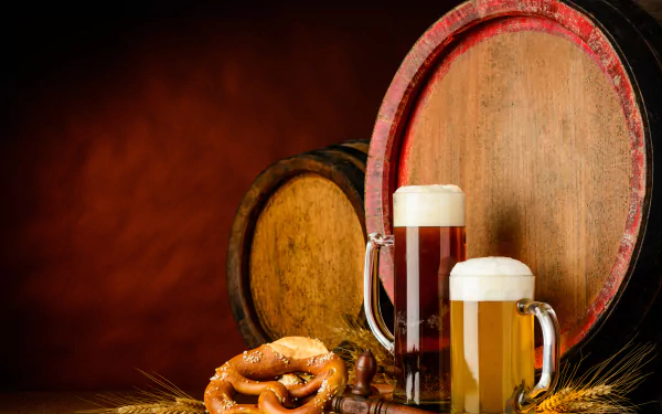 4K Ultra HD still life wallpaper featuring wooden barrels, two glasses of beer, a pretzel, and scattered barley on a warm brown background.