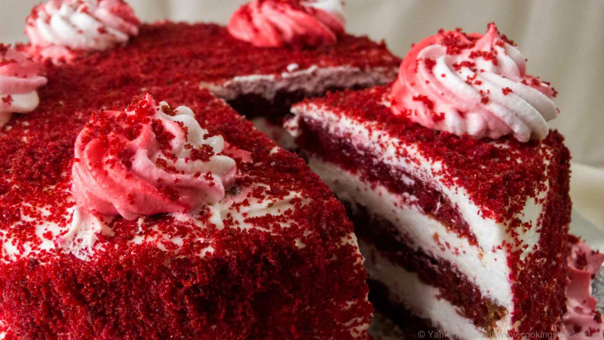 HD PC desktop wallpaper featuring a rich red velvet cake with layers of cream and decorative frosting, showcasing an appetizing pastry and dessert close-up.