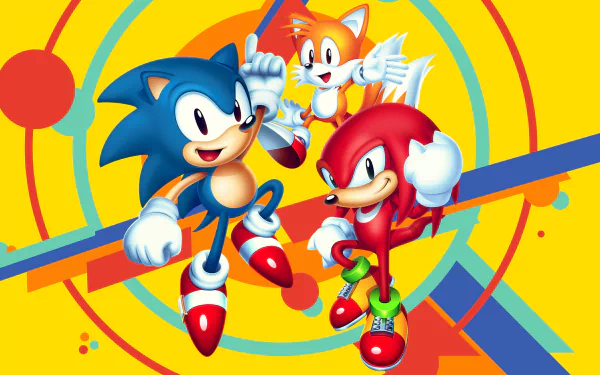 A vibrant HD wallpaper featuring Classic Sonic, Tails, and Knuckles from Sonic Mania, with a dynamic yellow background and colorful shapes.