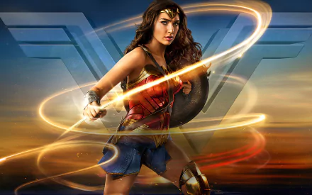 HD desktop wallpaper featuring Gal Gadot as Wonder Woman in action, with the iconic W symbol in the background.