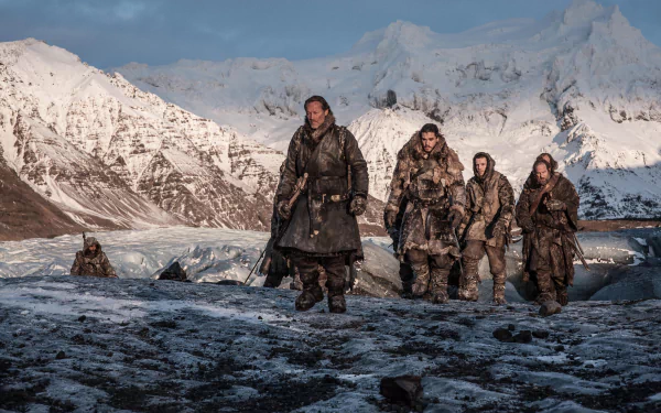 4K Game of Thrones desktop wallpaper: Thoros of Myr, Gendry, Jon Snow and Jorah Mormont trek across a snowy, mountainous landscape.